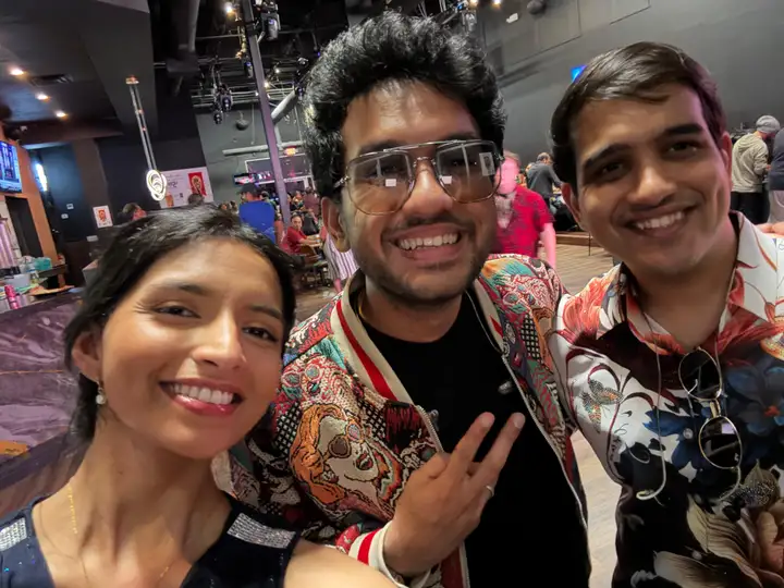 Three band members in a pre-show selfie inside the Dallas venue.